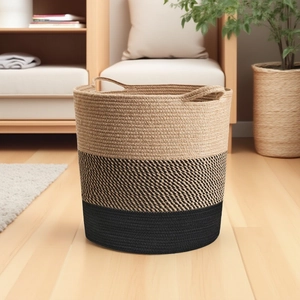 Detail of three-tone woven cotton rope storage basket with integrated handles and texture