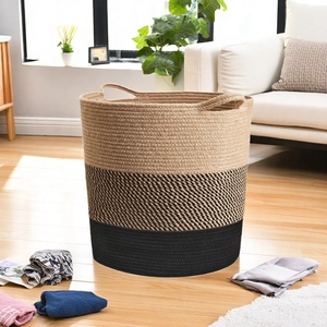 Detail of Nordic woven cotton rope storage basket with three-tone color block and handles