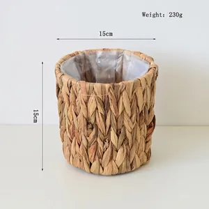 Detail of round water hyacinth basket with waterproof plastic liner for plant pots