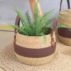 Close-up of seagrass woven planter with durable handles and natural texture detail
