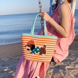 Detailed view of striped woven tote bag featuring a cute 3D cartoon puppy embroidery