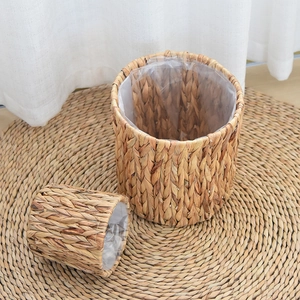 Detail of hand-woven water hyacinth basket showing natural texture and waterproof plastic liner