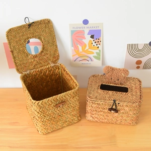 Handwoven straw tissue box featuring natural seagrass texture and wooden button closure