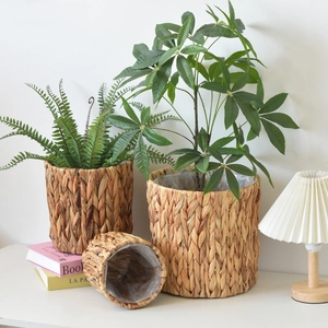 Detail view of woven water hyacinth planter baskets with waterproof plastic inner lining