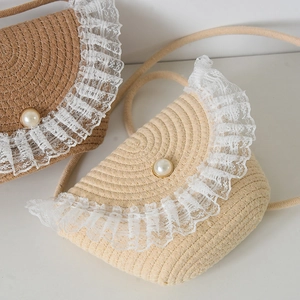 Handwoven straw bucket bag set with white lace trim and pearl buckle for summer beach trips