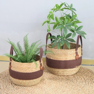 Handwoven seagrass plant baskets set of two with brown handles for home storage