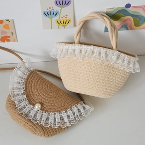 Detailed view of woven straw tote and crossbody bag with elegant white lace trim accents