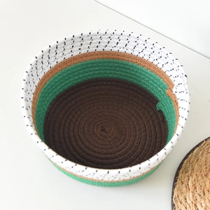 Detail of multi-color woven fiber storage basket with smooth round edges for home decor