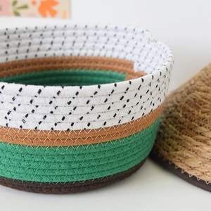 Close-up of woven cotton rope gift basket featuring a multi-color patchwork design