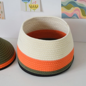 Detail of multi-color cotton rope storage basket with lid for home organization