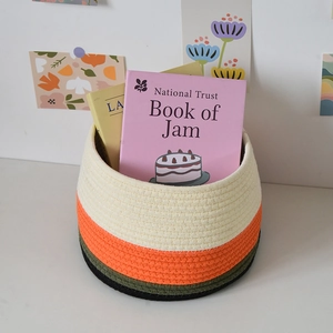 Detail of four-color stitched cotton rope storage basket for nordic desk organization