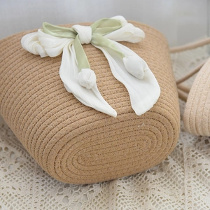 Detailed macro view of woven texture with silk bow and tulip charm decoration