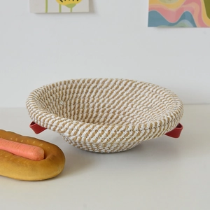 Handwoven sourdough proofing basket made of cotton rope with red leather side handles