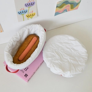 Three-piece oval pet plush bed with red handle carrot cushion and matching white cover