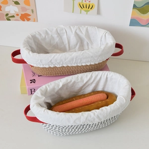 Detail view of oval proofing baskets with removable fabric liners and red leather handles