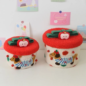 Detail view of plush dog-themed storage stools with apple lid and soft fleece texture