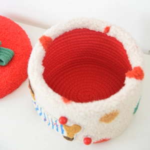 Detail view of woven dachshund storage basket with red polka dot lid and soft wool fabric