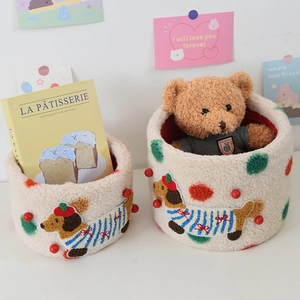 Close-up of cute dachshund lamb wool storage baskets with polka dots and red lining