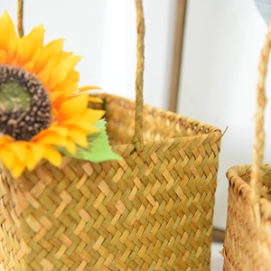 Close-up of hand-woven natural seagrass basket with detailed herringbone pattern