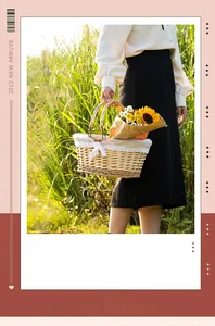 Close-up of a handmade willow picnic basket with white lace liner and flowers