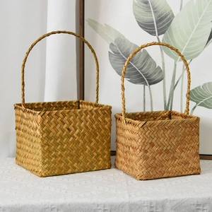 Handwoven square seagrass flower baskets with handles in a minimalist home setting
