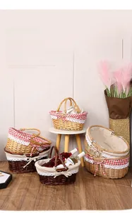 Detail of hand-woven wicker basket featuring natural willow textures and a red checkered liner