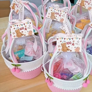 Pink and white woven cotton basket with cherry charms and 100 days celebration card