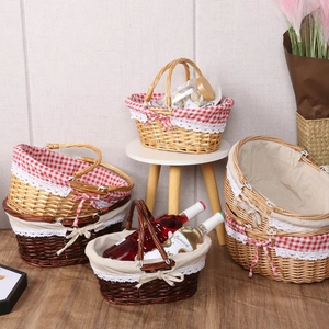 Handwoven willow picnic baskets with lace liners in various shapes and sizes