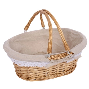 Natural woven wicker picnic basket with beige linen lining and white lace trim