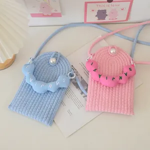 Mini woven pearl phone cross-body bag in sky blue and pink for summer vacations