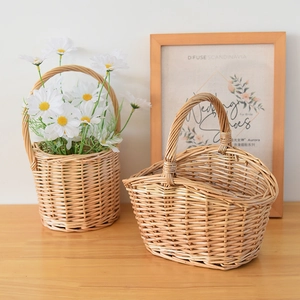 Close-up of handmade wicker baskets with floral arrangement and woven texture detail