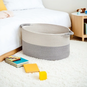 Large cotton rope woven storage basket in cream and grey with handles for home organization