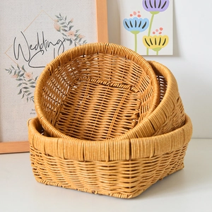 Three-piece set of woven rattan storage baskets for bread and fruit in natural wood color