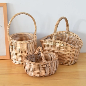 Close-up of three handcrafted wicker baskets showing detailed natural woven textures