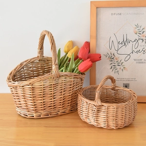 Set of two handmade wicker storage baskets with handles for fruits, flowers and picnics