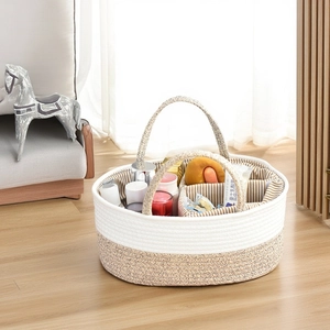Detail of cotton rope baby diaper caddy with three compartments and striped lining