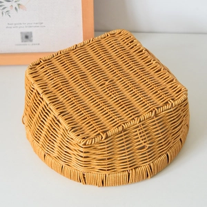 Detail of tight weave pattern on light brown faux rattan fruit and bread storage basket