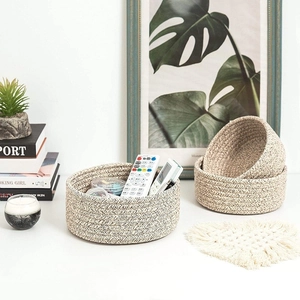 Japanese style woven cotton rope storage baskets in beige and light brown tones