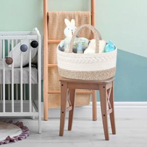 Detail of a large woven cotton diaper caddy with reinforced handles and two-tone texture