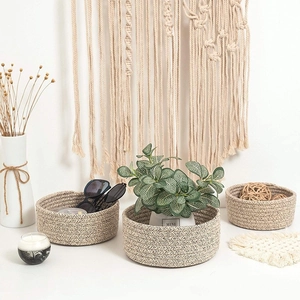 Detailed macro view of woven cotton rope baskets showing the thick chevron textured fiber