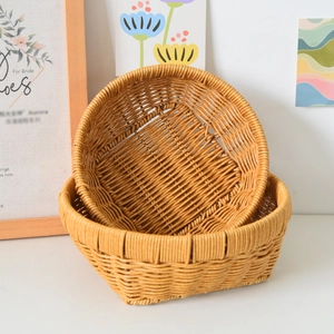 Detail of hand-woven light brown rattan storage baskets in a stacked nest design