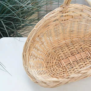 Close-up of the intricate hand-woven willow texture on a natural wicker picnic basket