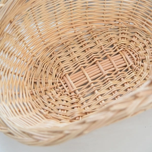 Detailed macro view of the hand-woven texture and interior of a natural willow basket