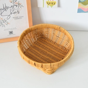 Close-up of bright yellow woven storage basket with dense rattan-like texture and thick rim