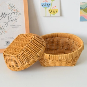 Detail of honey-brown woven storage baskets with lids in a warm lifestyle home setting