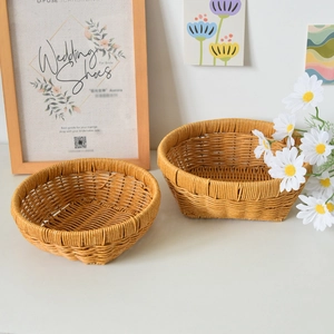 Detail of hand-woven imitation rattan storage baskets with reinforced edges and round base