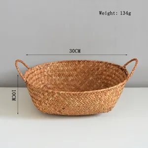 Detail of natural seagrass basket with handles, weighing 134g, sized 30x10cm
