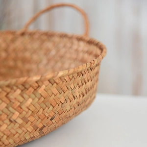 Macro detail of natural seagrass storage basket with handcrafted woven texture and handle