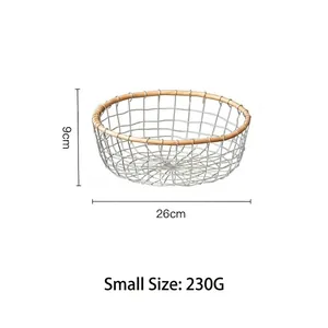 Detail view of small iron storage basket showing dimensions 26cm diameter and 9cm height