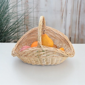 Detailed view of hand-woven wicker picnic basket with handle used as a fresh fruit holder